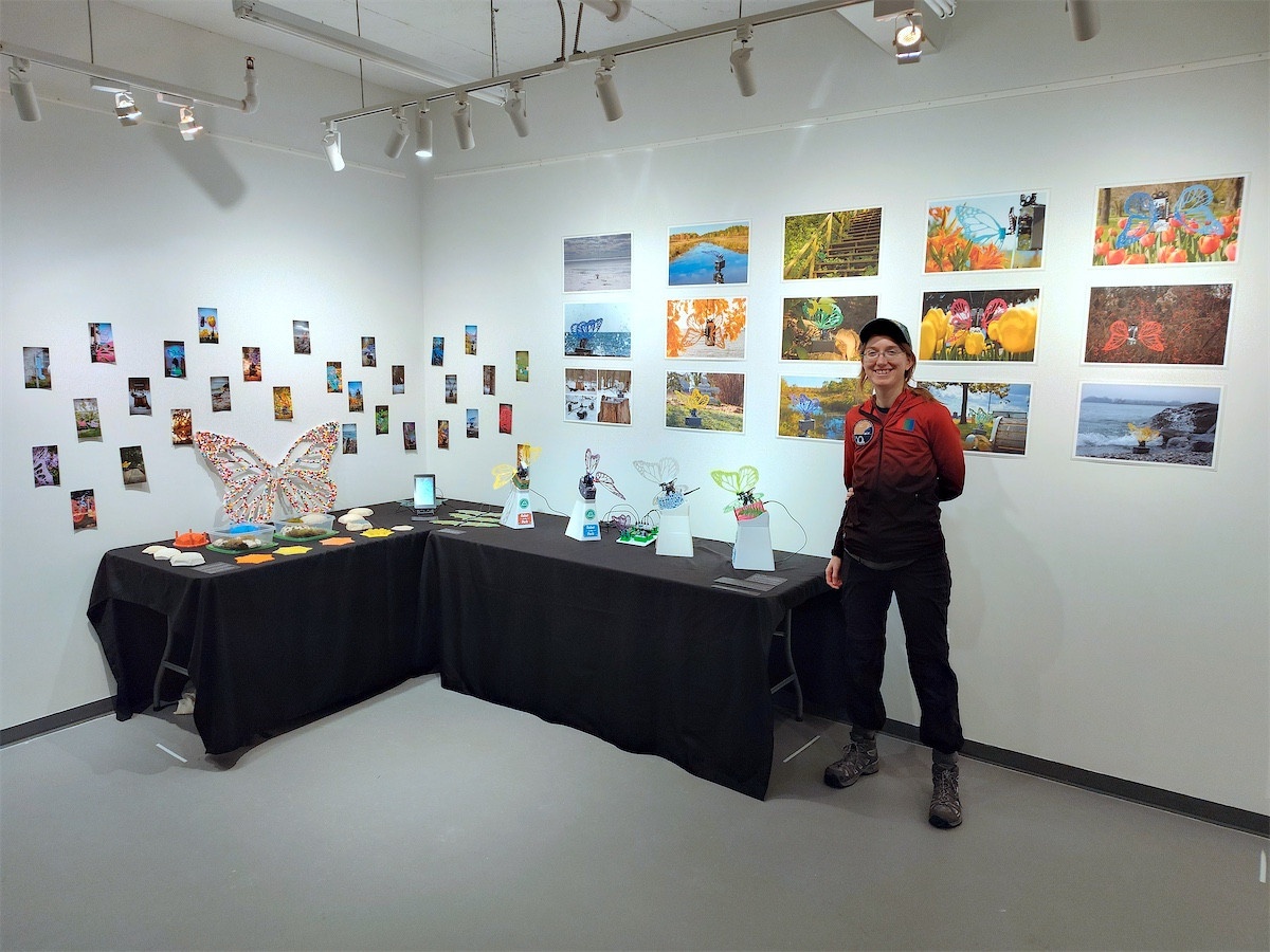 Erin next to the exhibition display