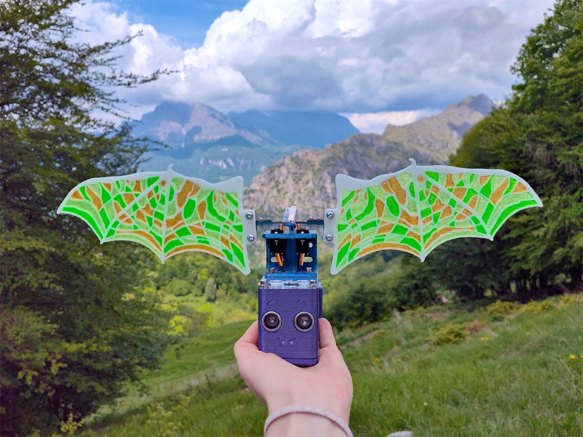 Robot Butterfly with bat wings infront of a mountain range