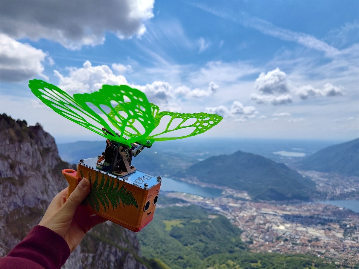 Robot Butterfly soaring over the town below
